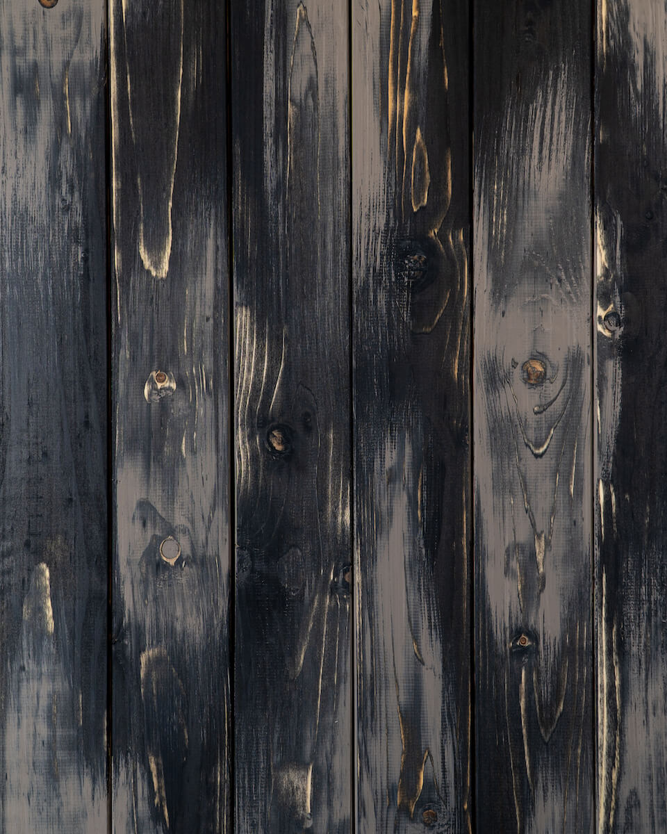 Fotohintergrund schwarz mit braunen Akzenten für Foodfotografie und Produktfotografie aus echtem Holz von FoodyBoard.